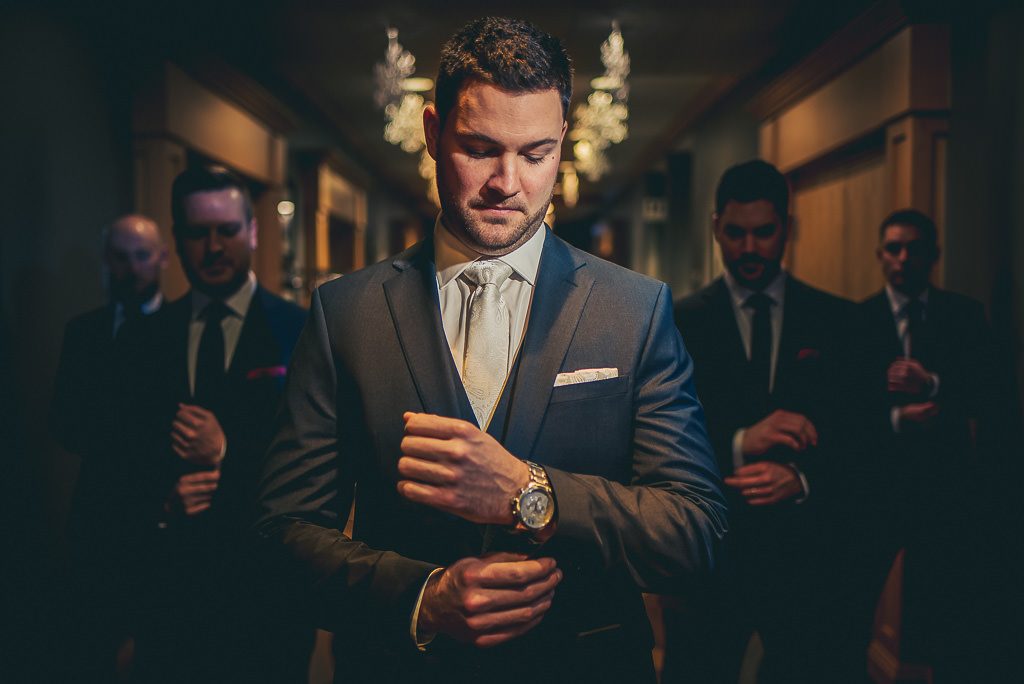 Portrait of groom getting ready for wedding at Cambridge Hotel and conference centre 