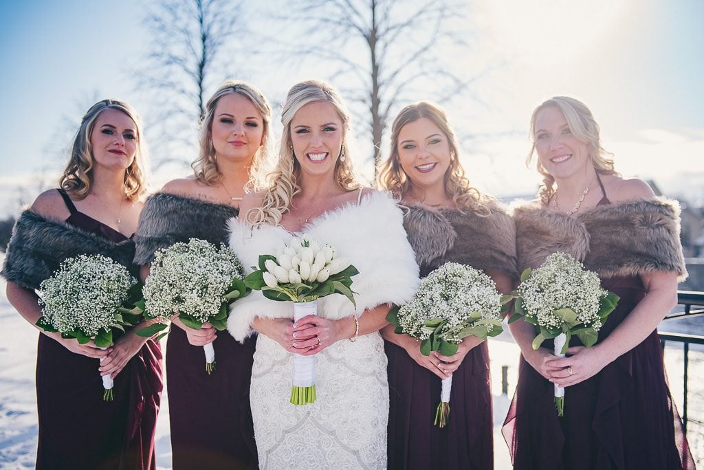 Bride and her bridal party in mill race park