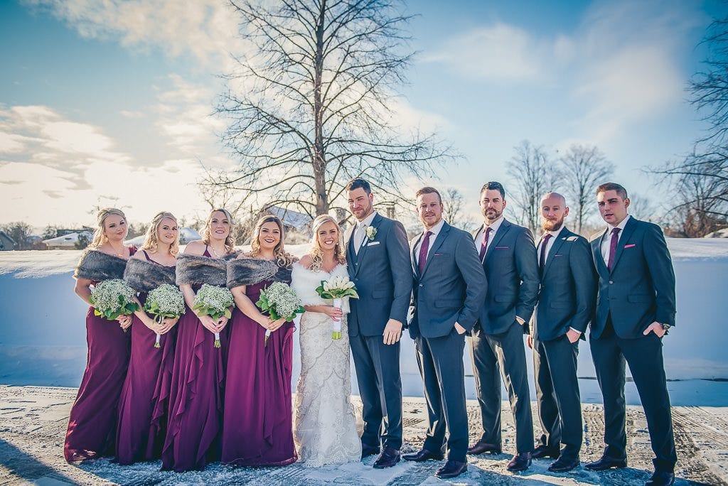 wedding party photo in mill race park in winter time