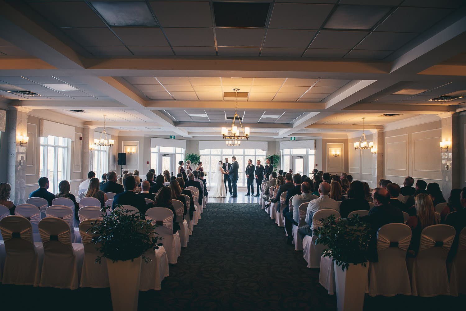 wedding ceremony in the grand ballroom at the Elmhurst Inn