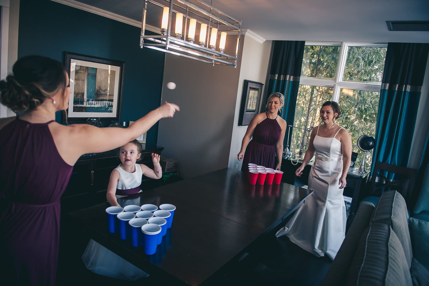 bridesmaids playing beer pong at the Elmhurst Inn before wedding