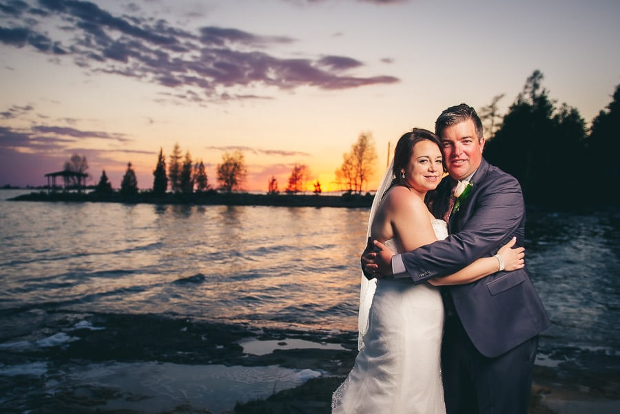 bride and groom on beach at dusk