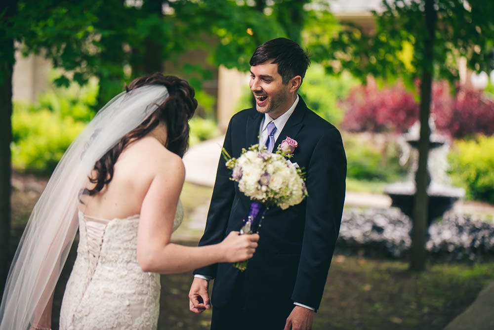 groom sees his bride for the first time  before their wedding at the Elmhurst Inn