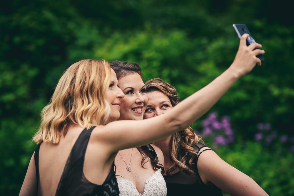 bride taking selfie at the Elmhurst Inn wedding