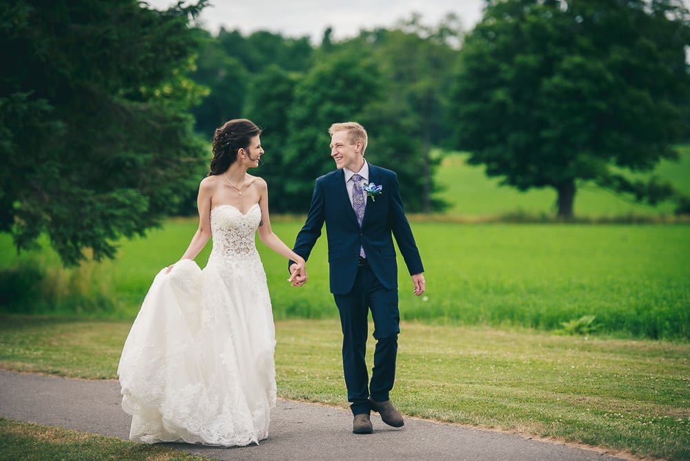 bride and groom walking at Mitchell golf club