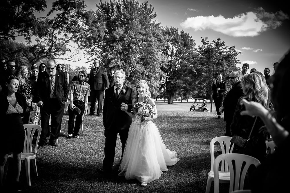 father walking daughter down the aisle at her wedding at craigowan golf club