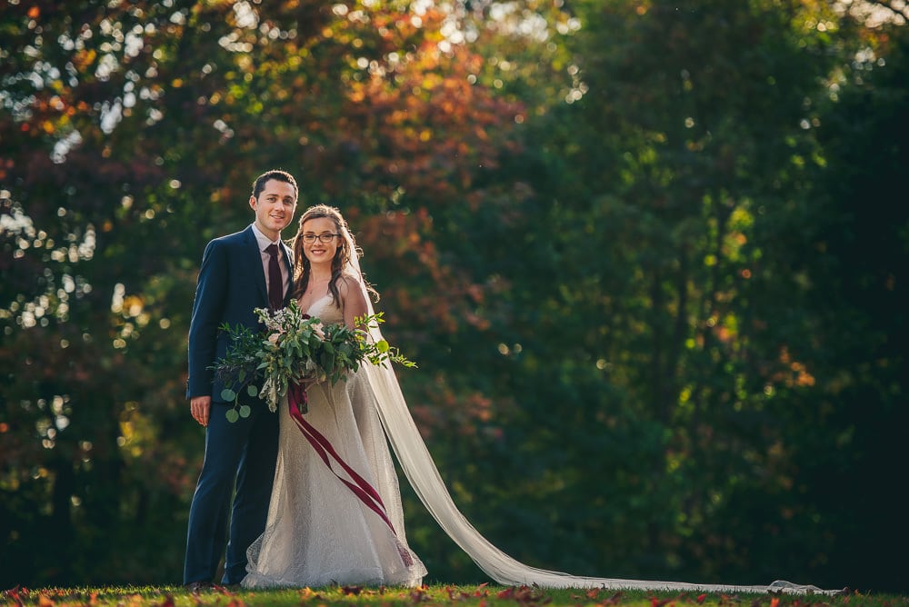 bride and groom photo at elsie Perrin wedding with long veil in London Ontario